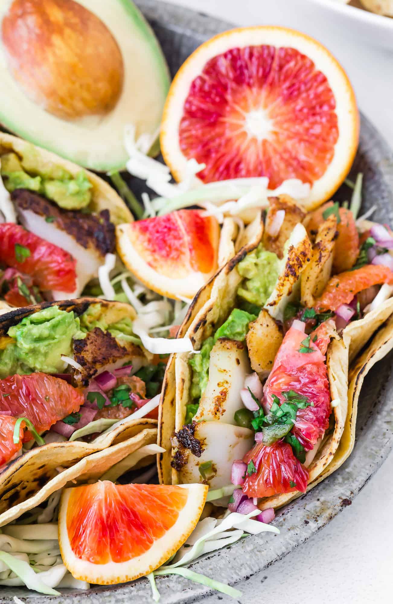 Fish tacos with citrus salsa and avocado.