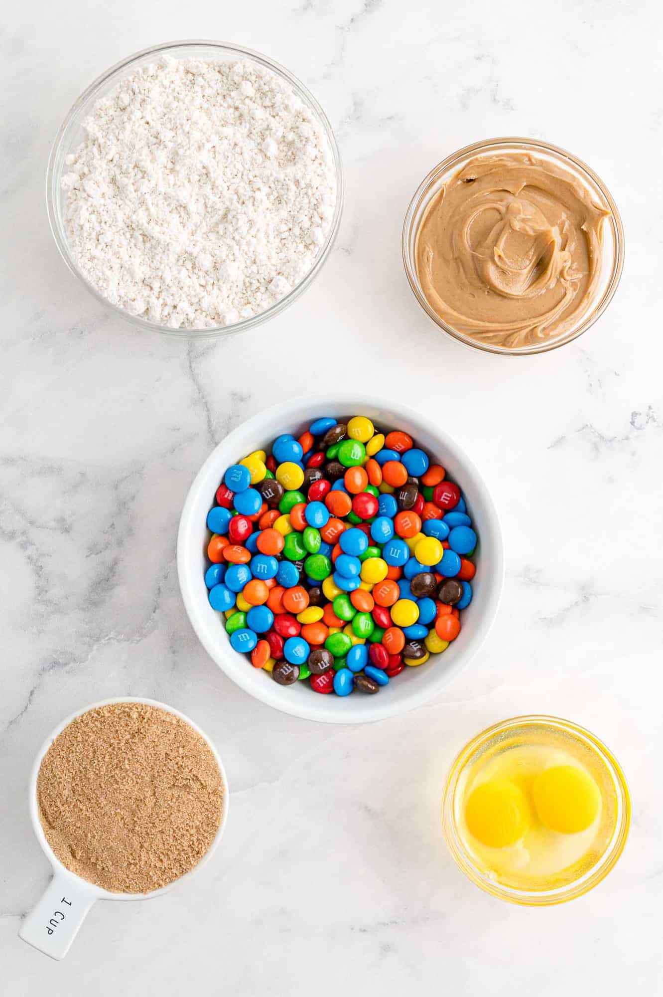 Overhead view of ingredients including peanut butter and M&Ms.