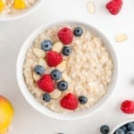 Crockpot oatmeal topped with raspberries, blueberries, almonds.