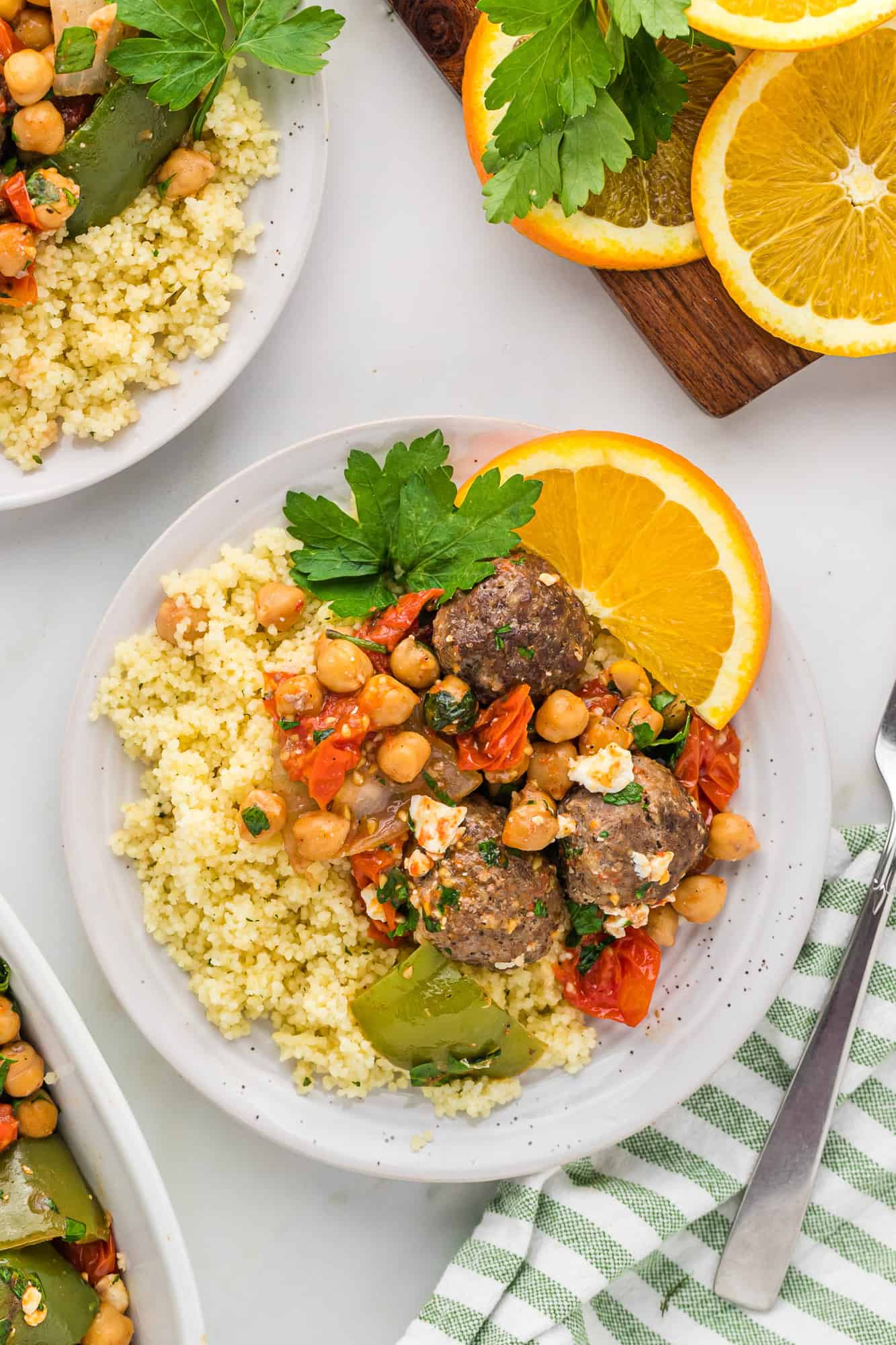 Plated Moroccan meatballs with chickpeas and tomatoes.