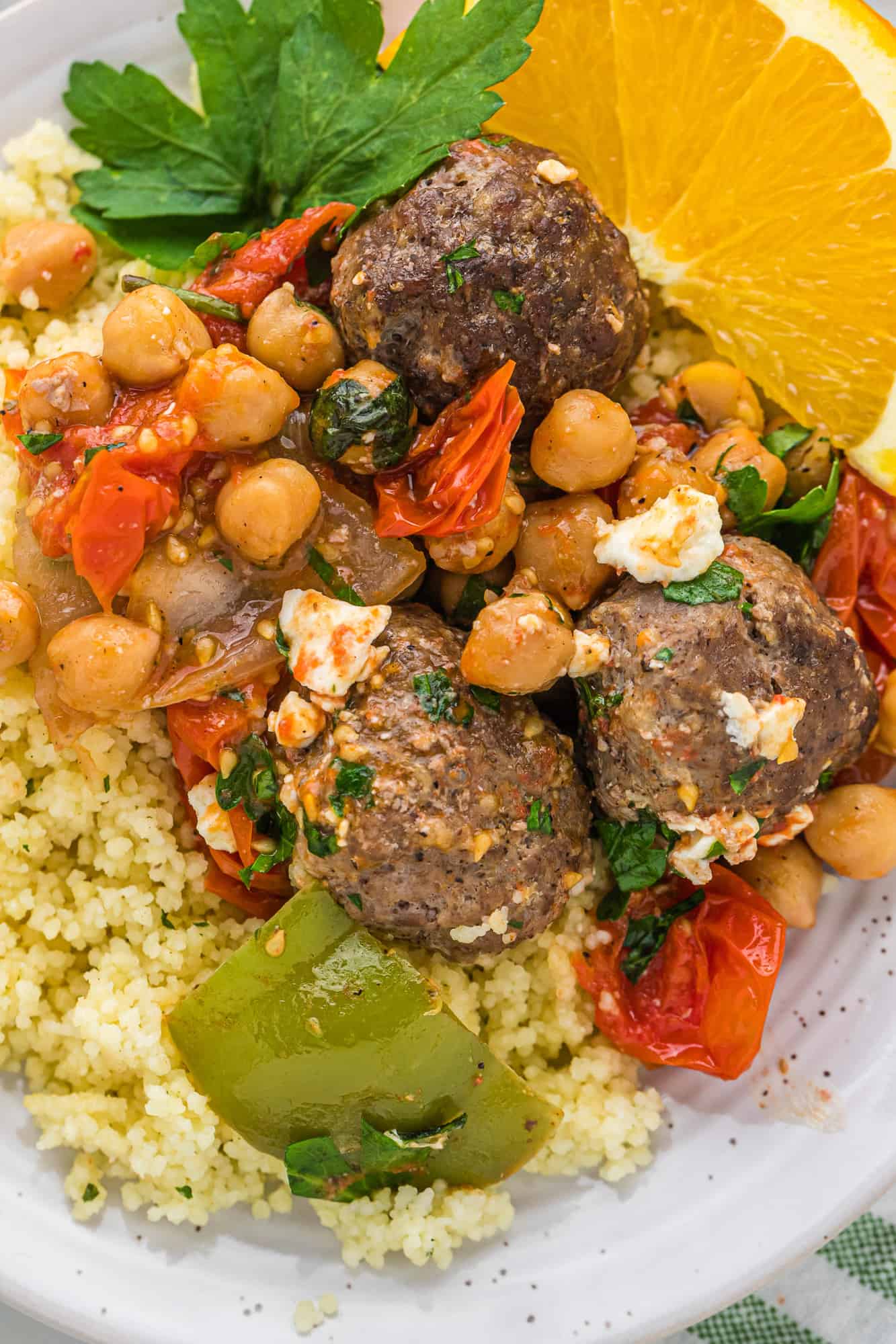 Close up view of moroccan meatballs on couscous.