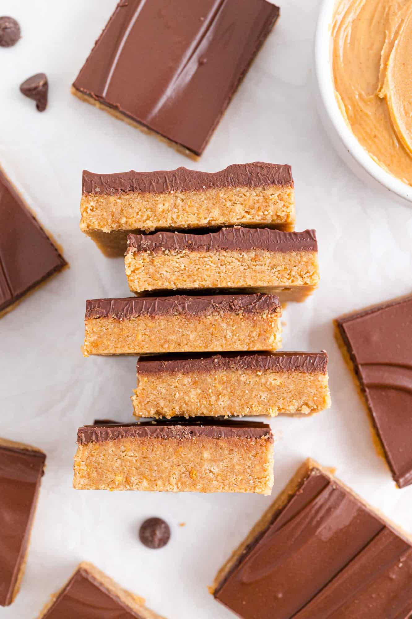 No bake peanut butter bars on side to show layers, more surrounding.