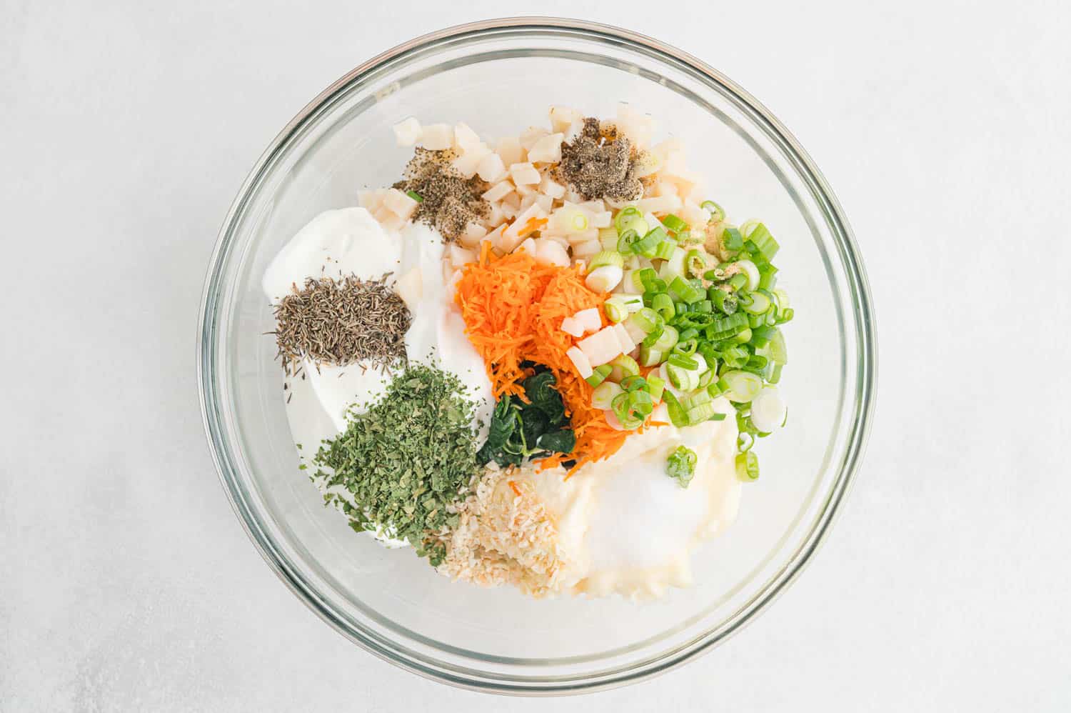 Ingredients, unmixed, in a clear glass bowl.
