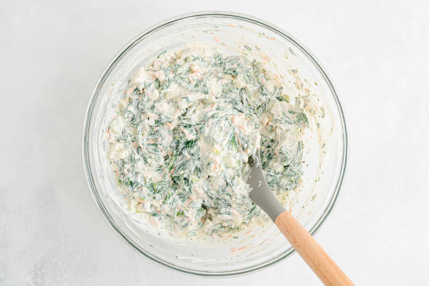 Spinach dip ingredients mixed together.