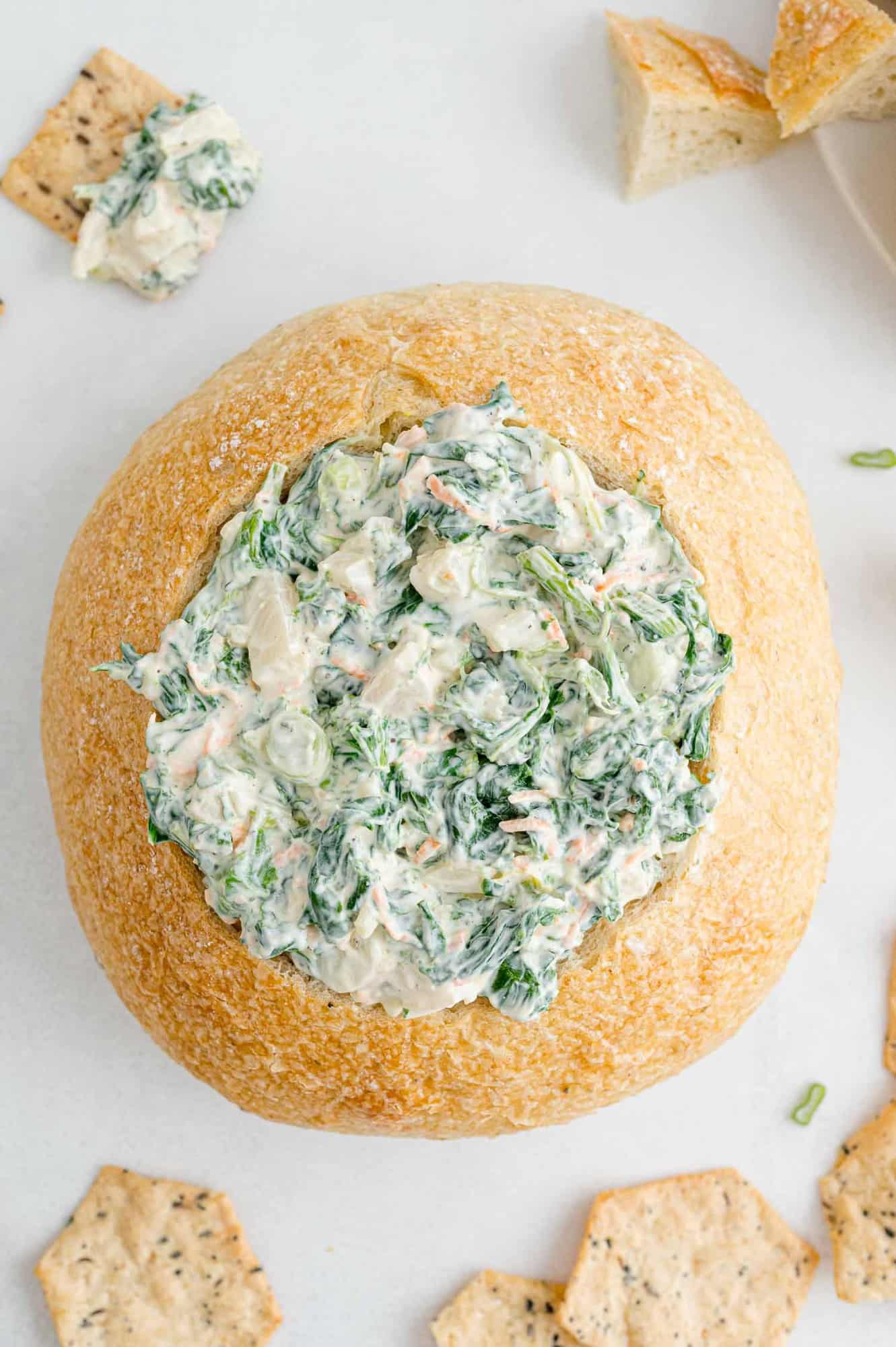 Homemade spinach dip in a bread bowl.