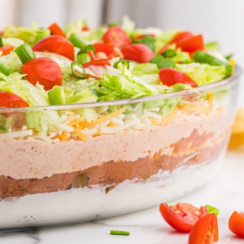 Straight on image of 7 layer dip to show layers in glass dish.