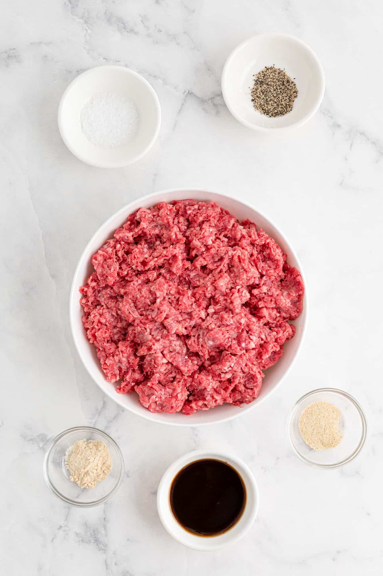 Ingredients needed to make air fryer hamburgers.