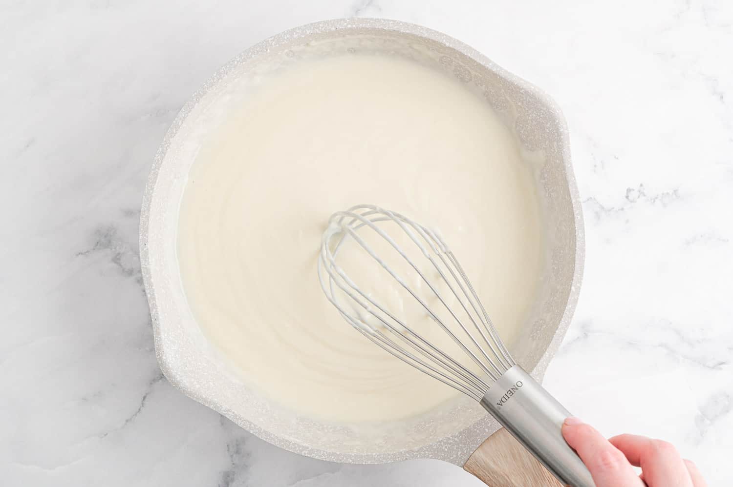 White sauce being made.