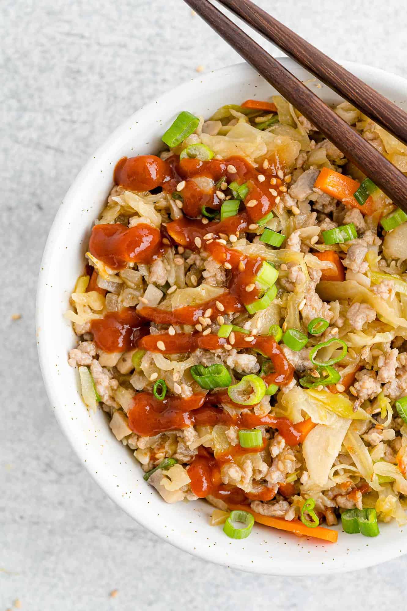 Close up of egg roll in a bowl.