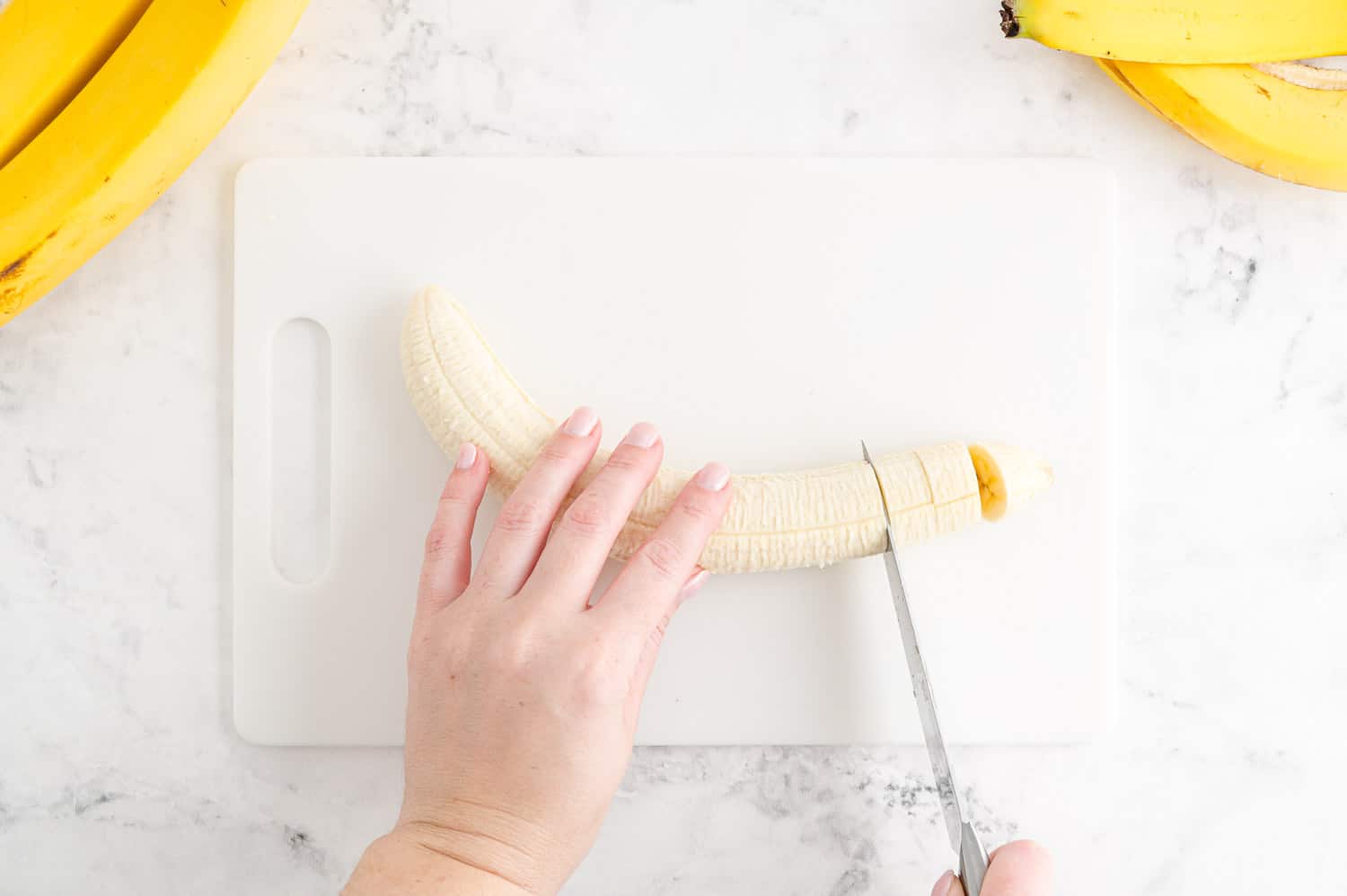 Banana being sliced.