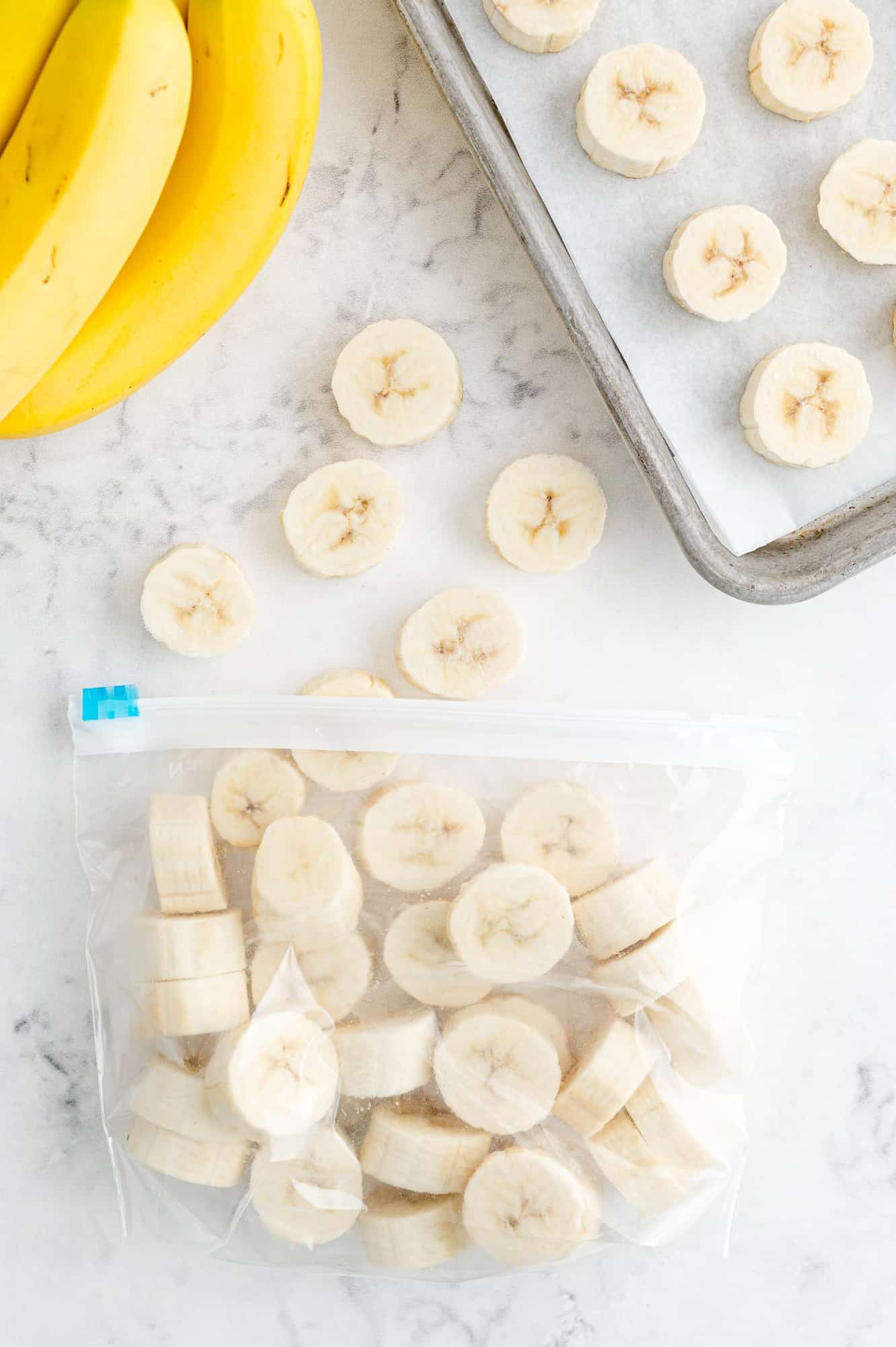 Sliced bananas in a bag, more nearby.