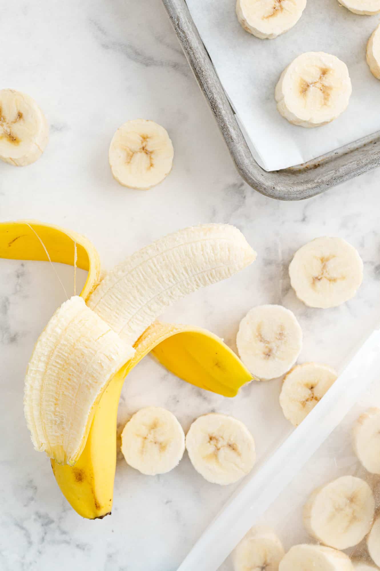 Peeled banana and banana slices.