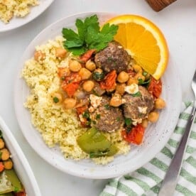 Plate of couscous and moroccan meatballs with chickpeas.