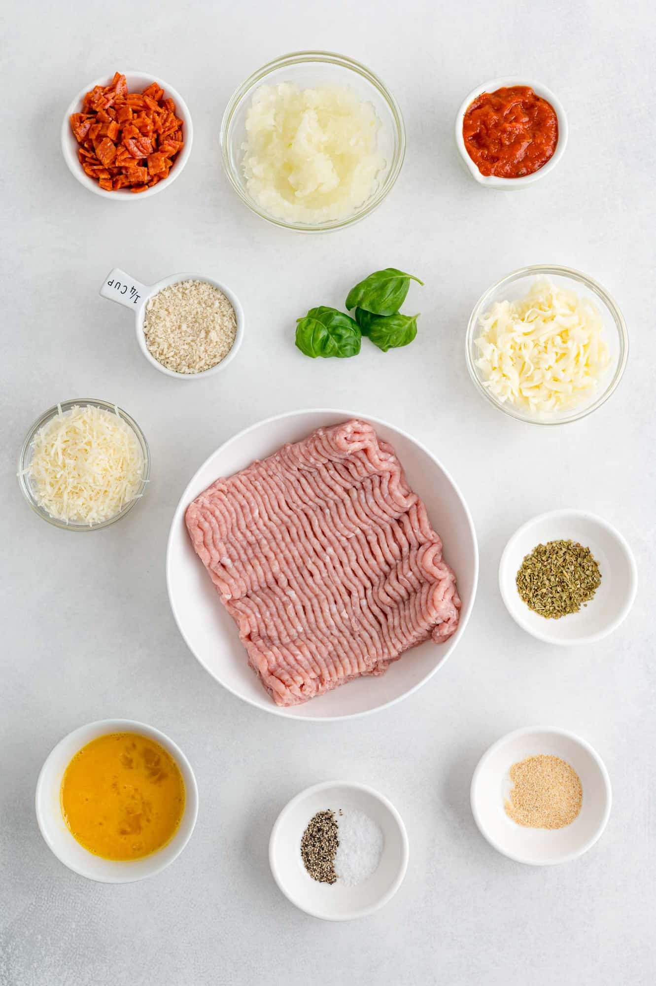 Ingredients in separate bowls, including ground turkey.