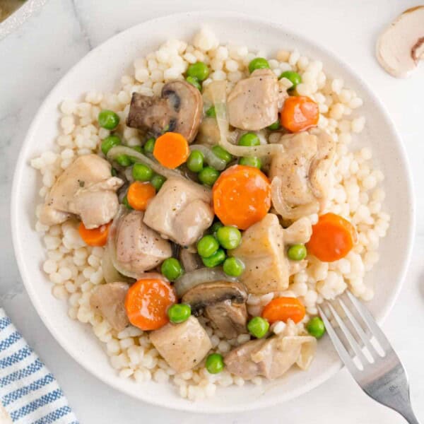 Chicken and vegetables served over couscous.