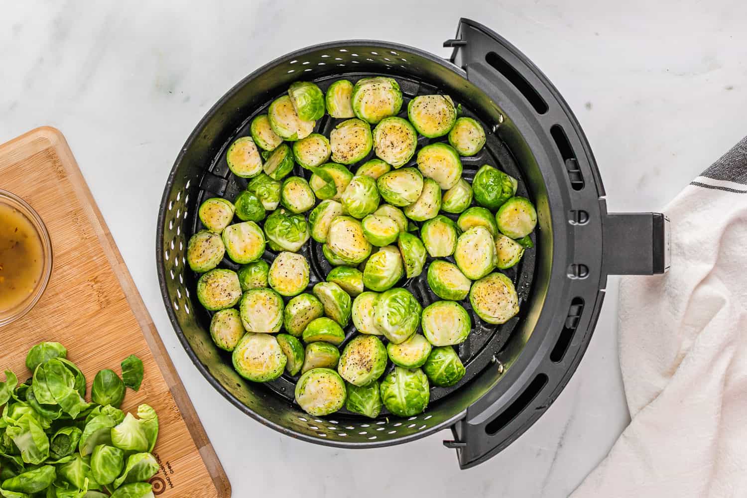 Brussels sprouts in air fryer, not yet cooked.