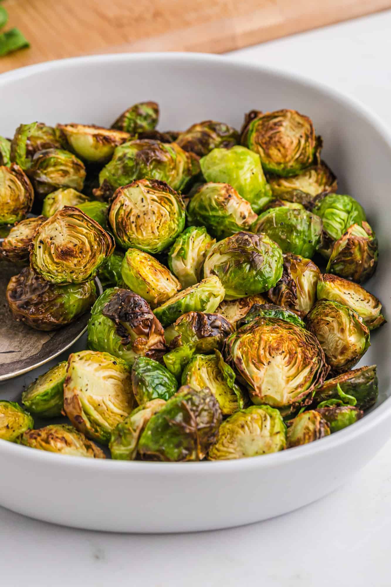 Cooked Brussels sprouts in a casserole dish.