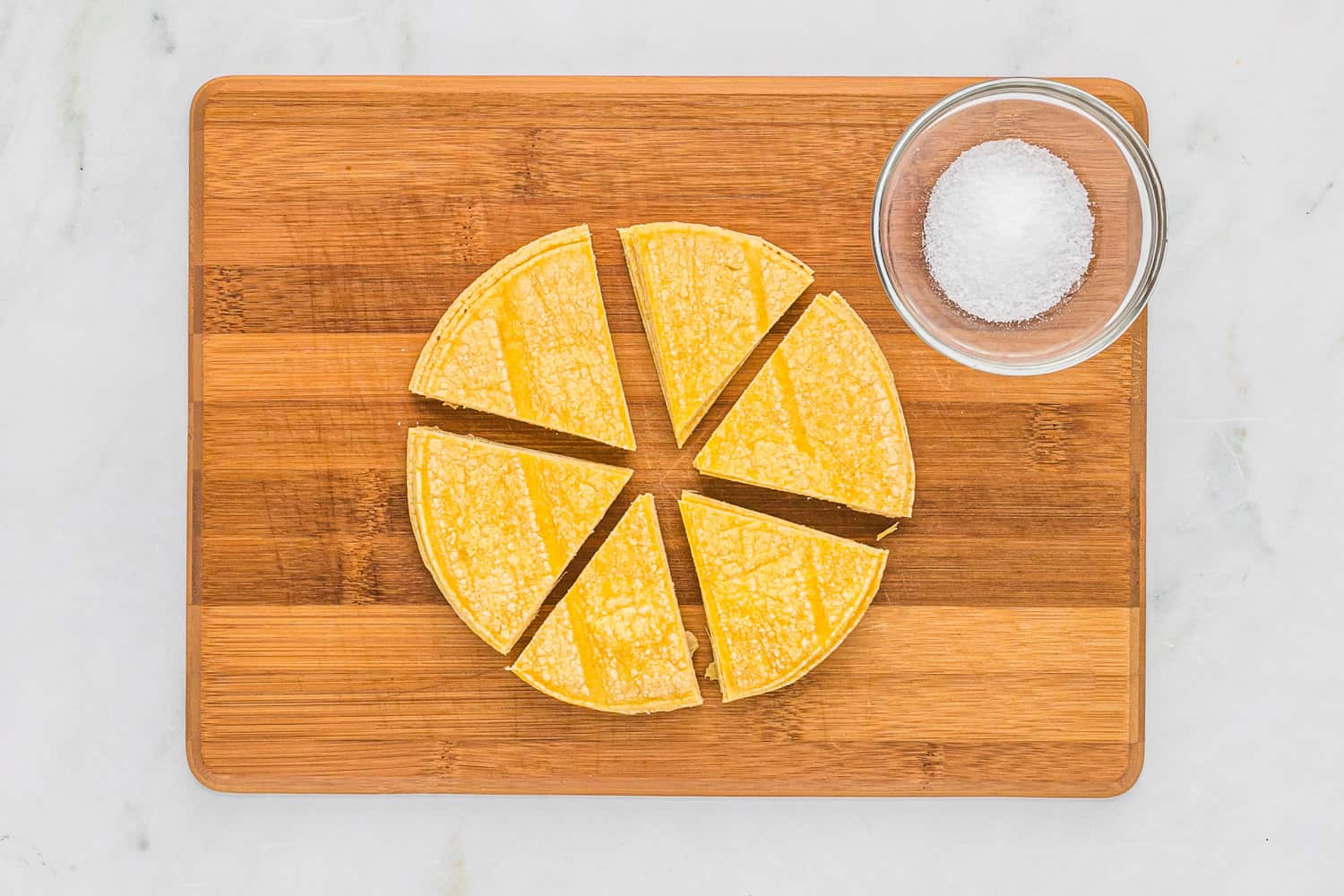 Stack of tortillas cut into six portions.