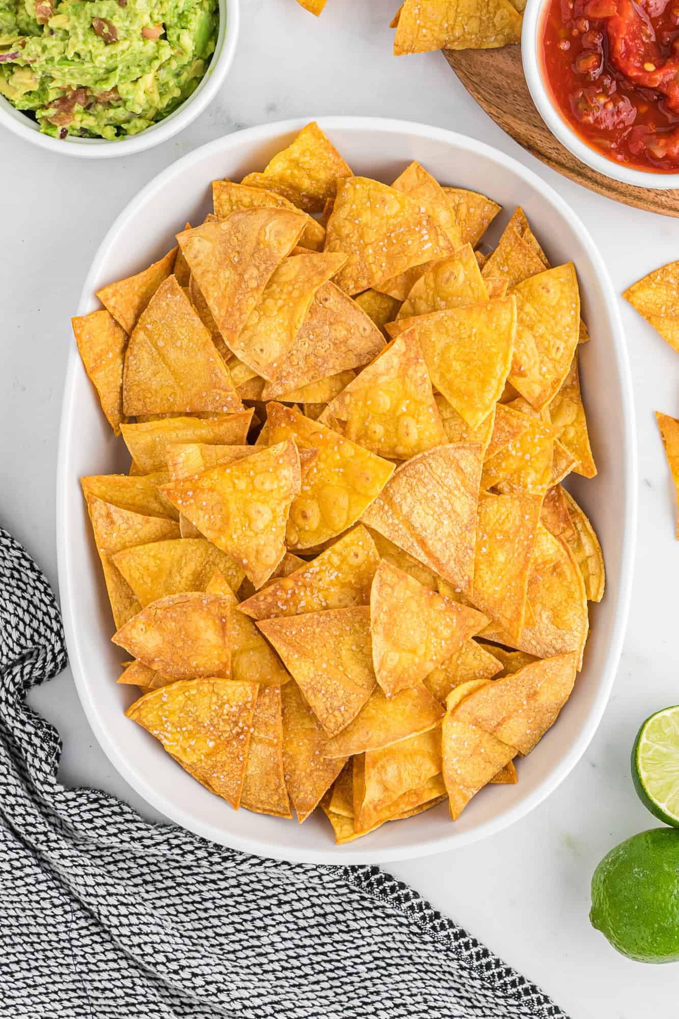 Tortilla chips in a large white dish.