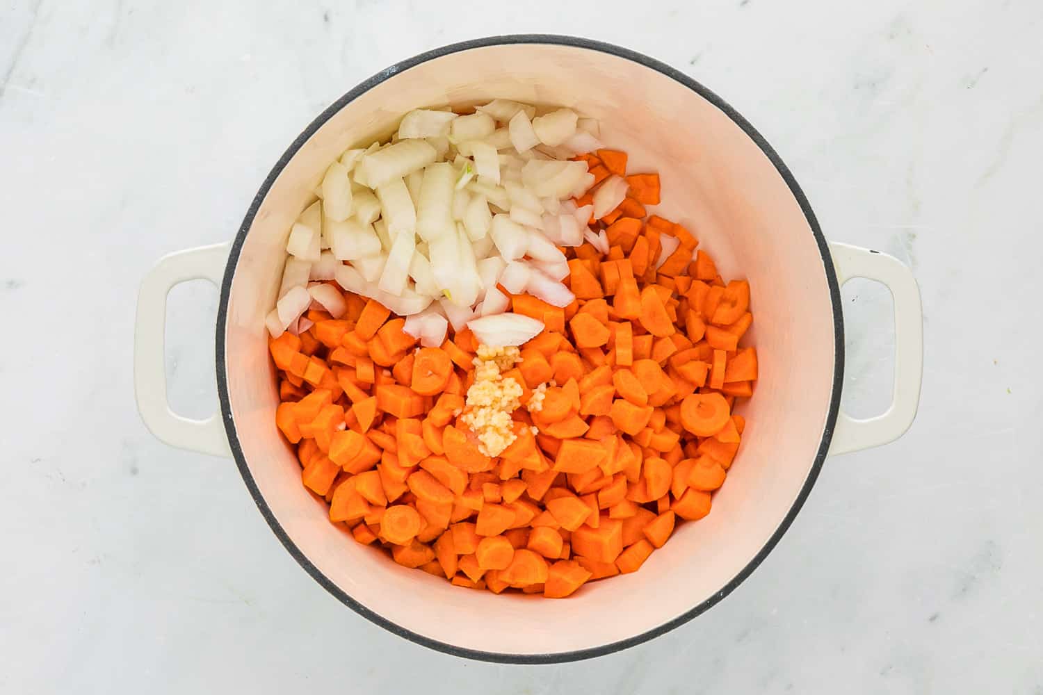 Carrots and onions in large pot.