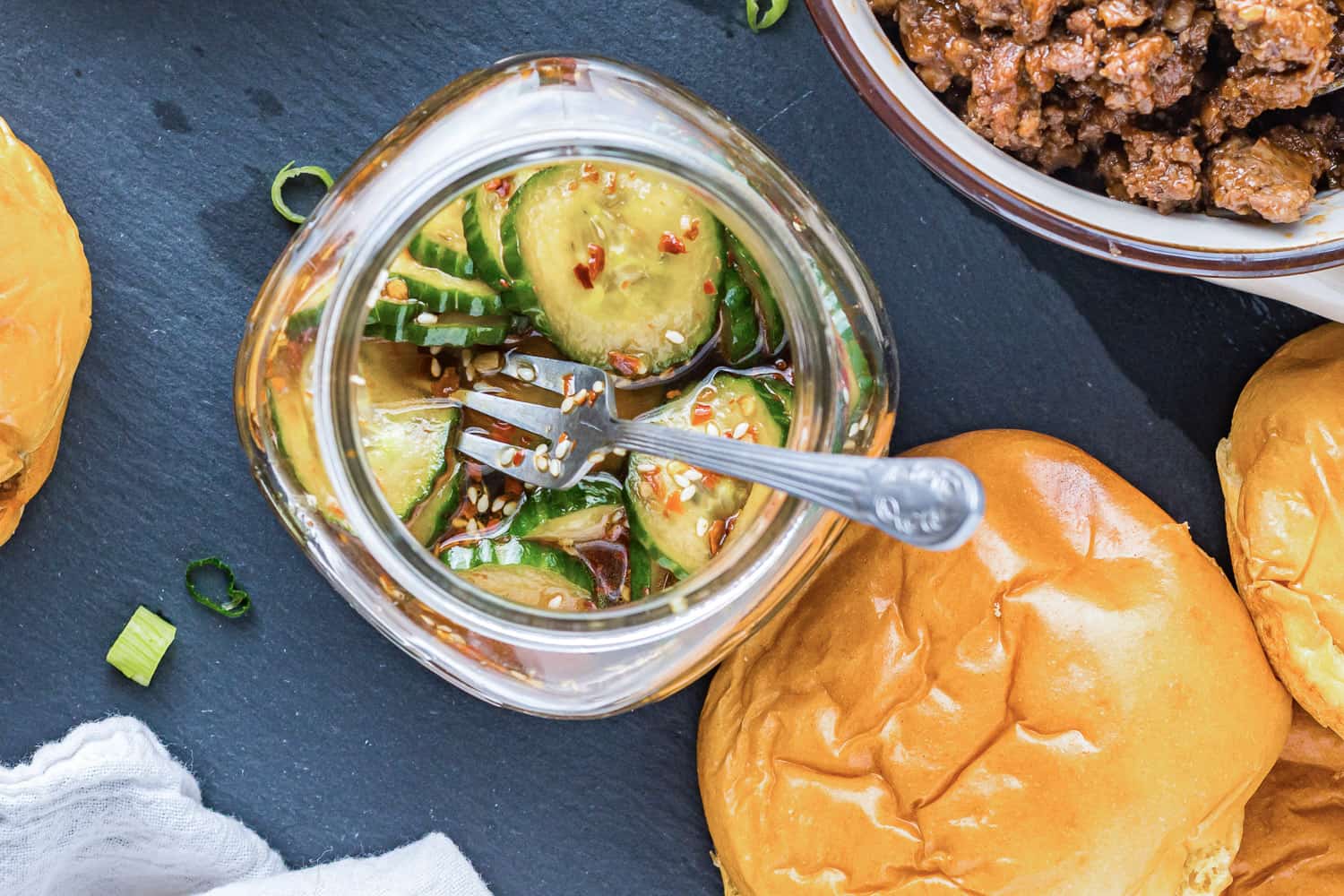 Pickles in a small glass jar.