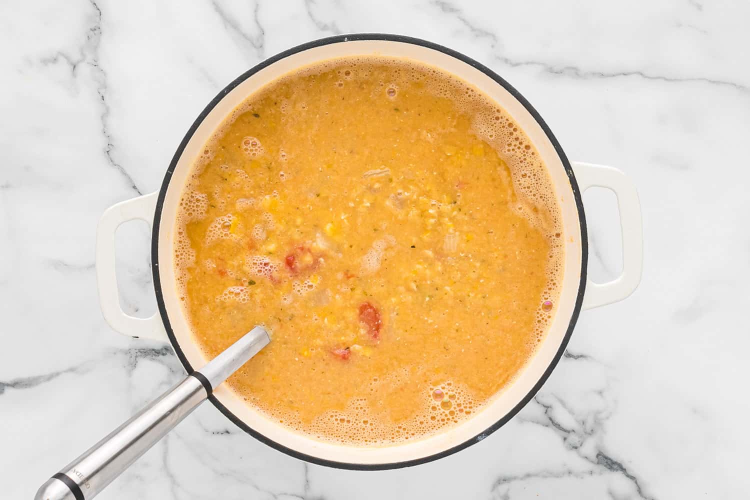 Soup with a ladle.