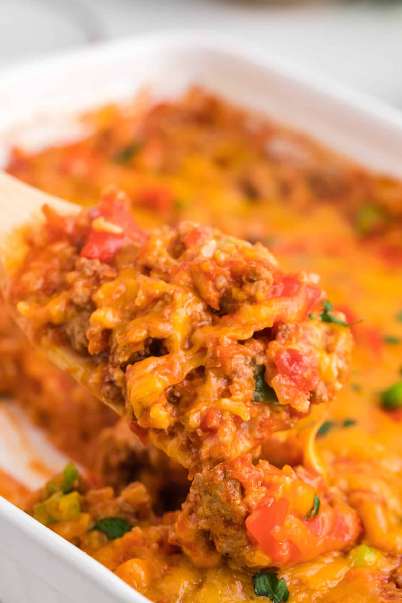 Stuffed pepper casserole on a serving spoon.