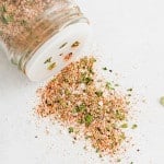 All purpose seasoning spilling out of a spice shaker.