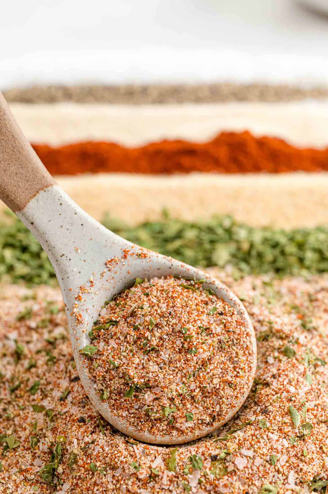 Seasoning mix with separate spices in background.