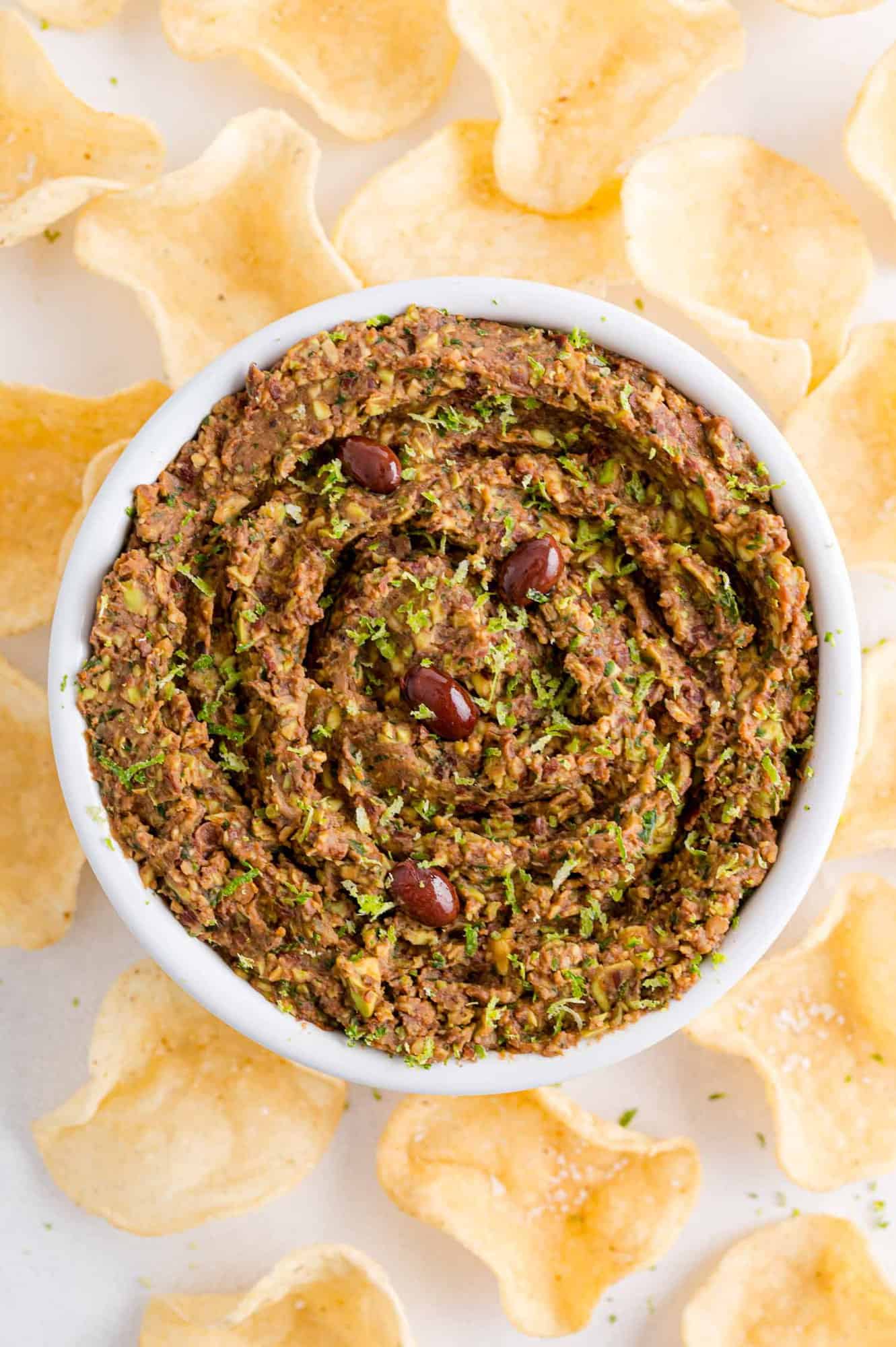 Overhead view of bean dip with tortilla chips.