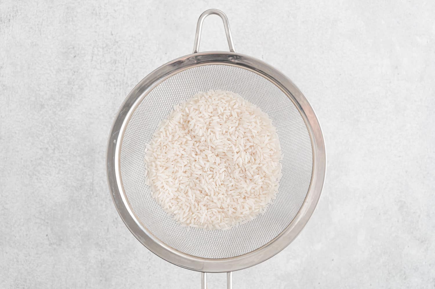 Rice in strainer.