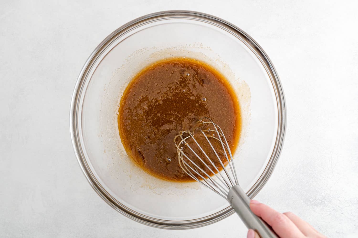 Wet ingredients being whisked.