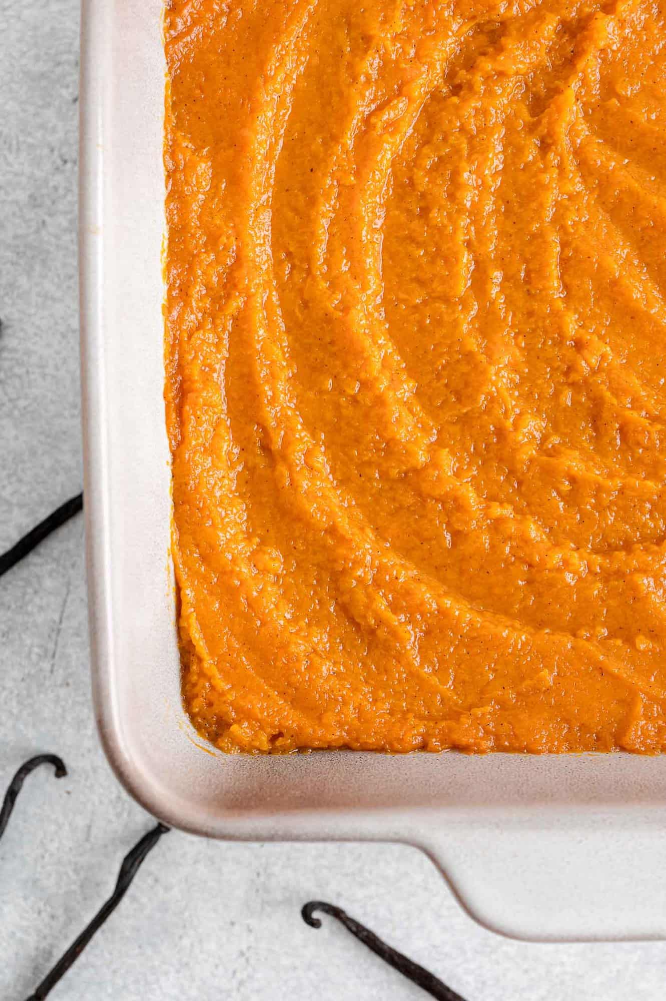 Sweet potatoes artfully spread into pan.