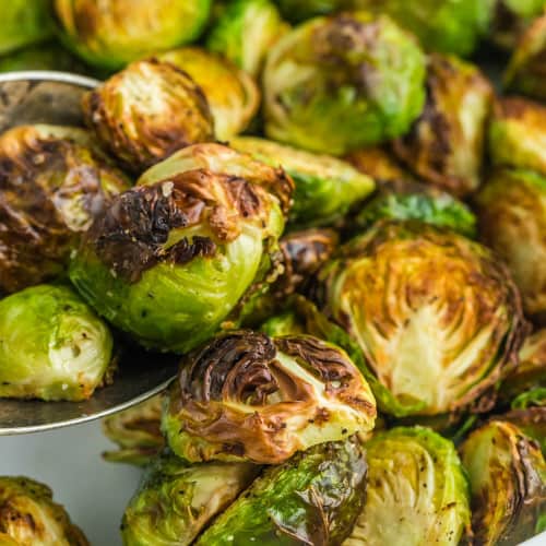 Close up of perfectly done air fryer brussels sprouts cut in half.