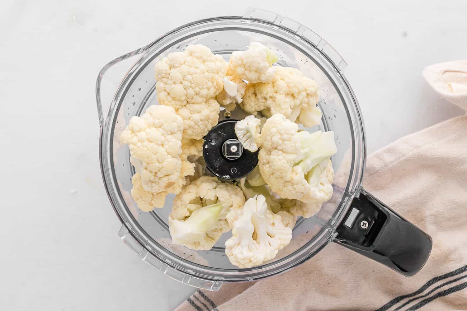 Cauliflower florets in a food processor.