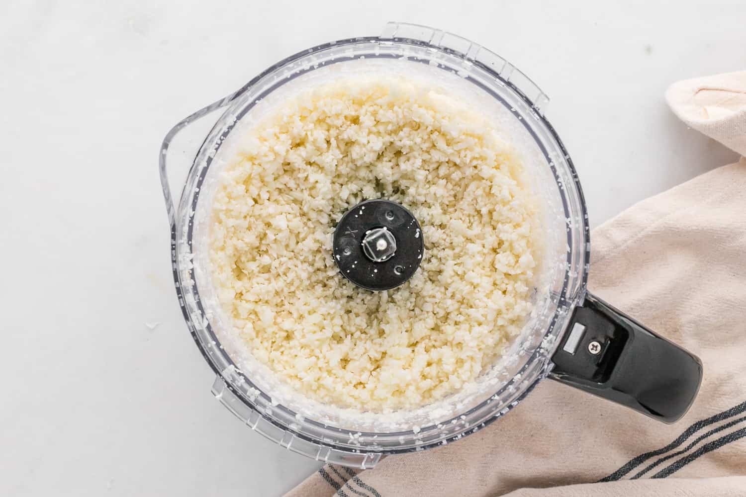 Cauliflower rice in a food processor.