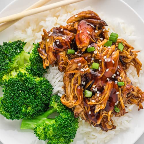 Crockpot teriyaki chicken on top of rice, with broccoli.