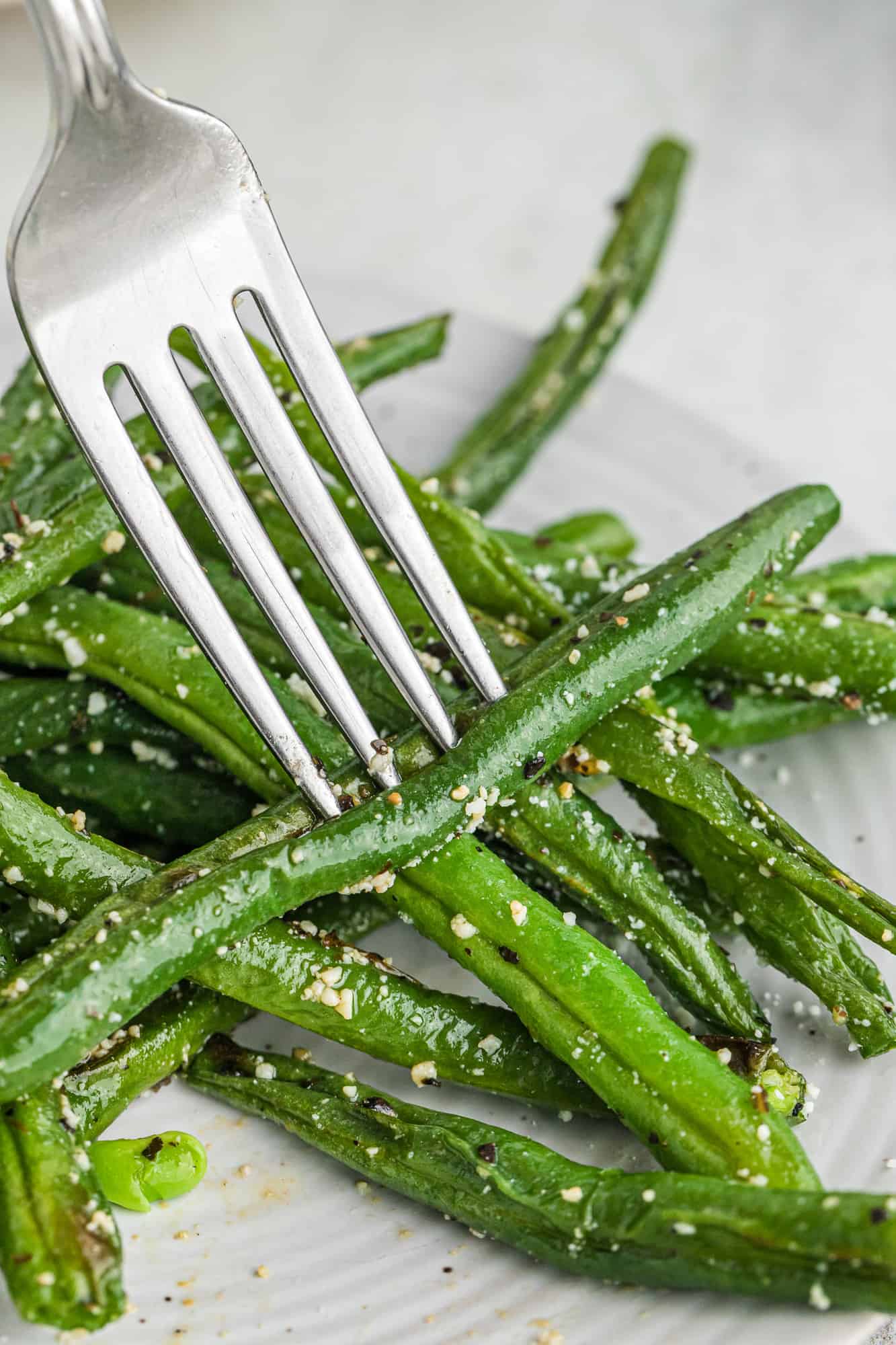 Green bean on a fork.