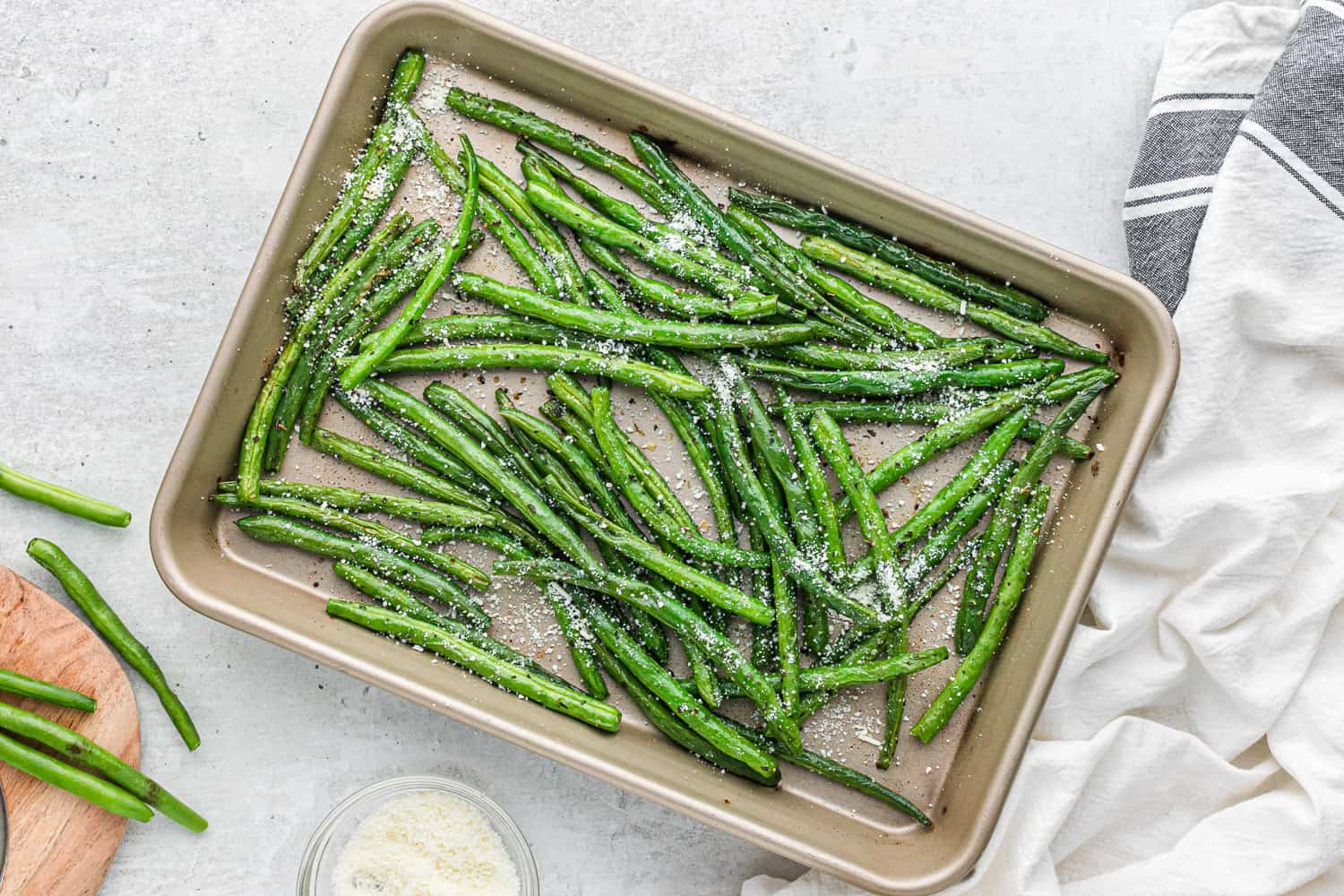 Roasted green beans on a sheet pan.