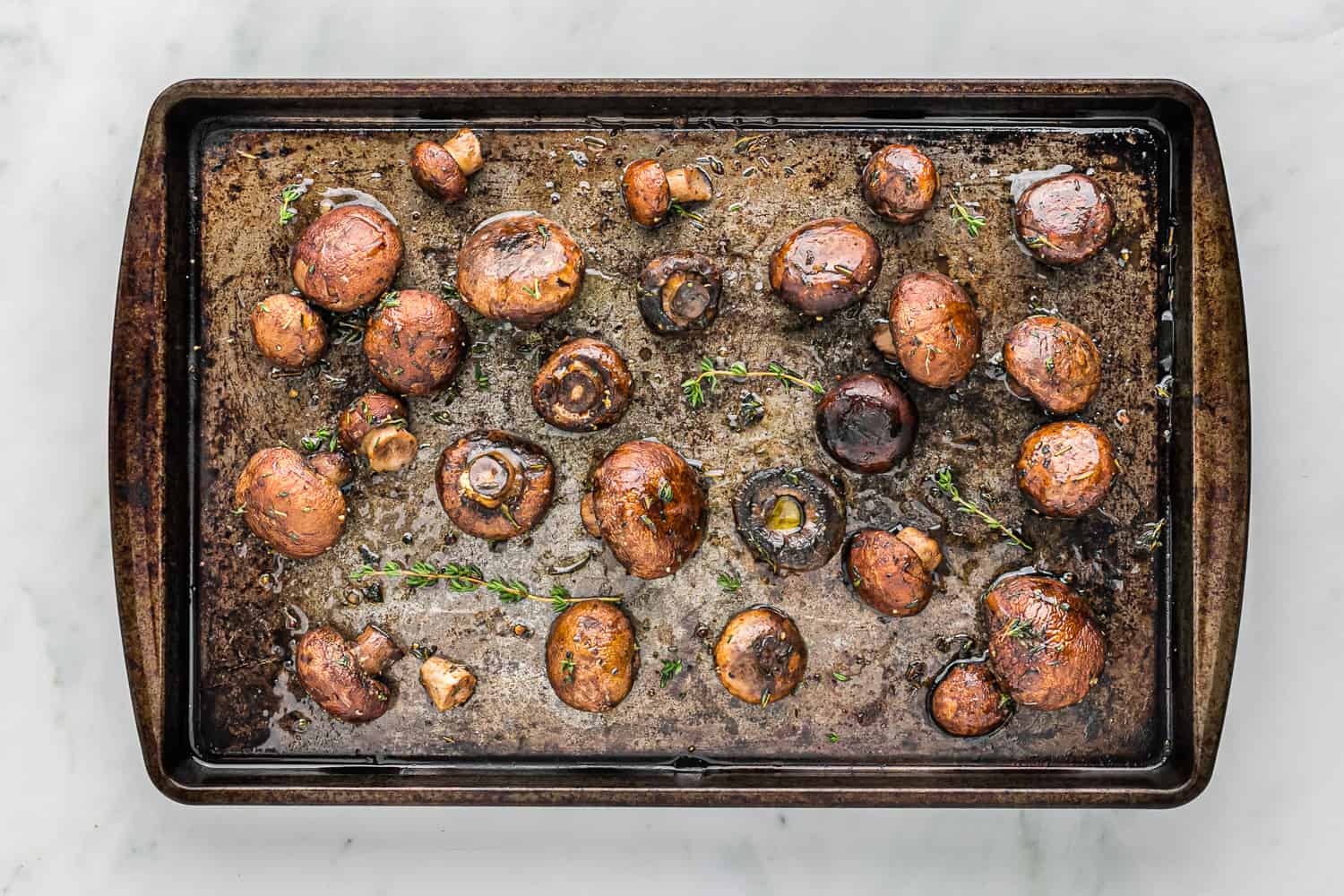 Roasted mushrooms on a sheet pan.