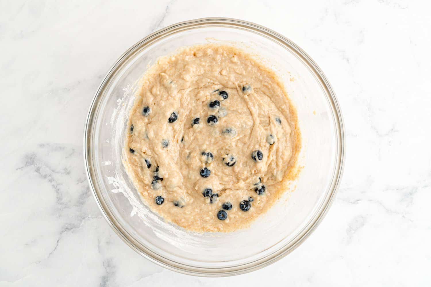 Blueberries folded into batter.