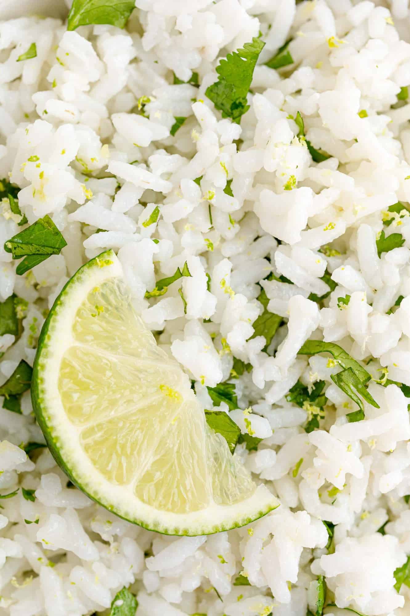 Rice with cilantro and lime, garnished with lime.