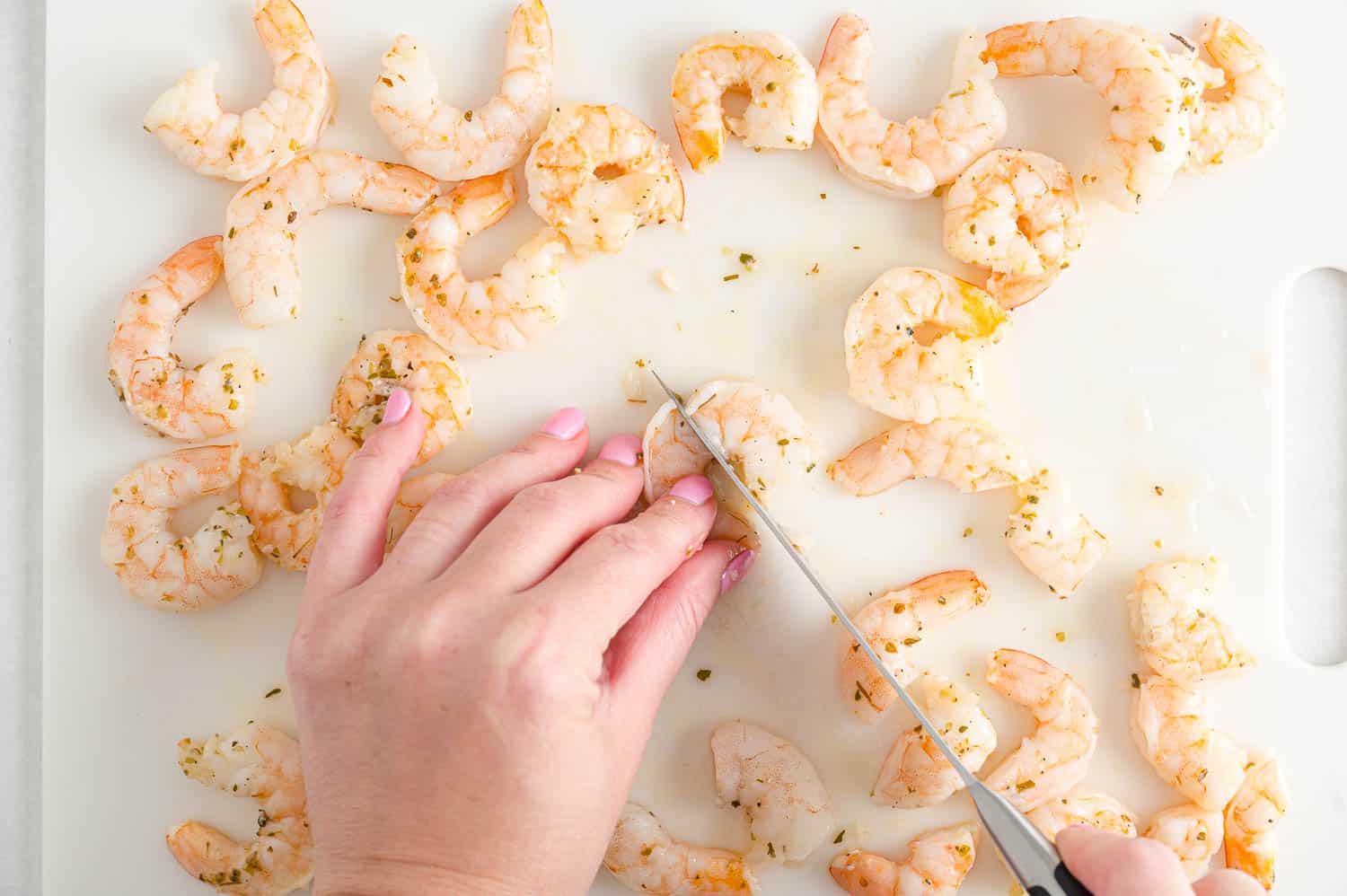 Shrimp being cut.