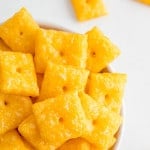 Homemade cheez-it crackers in a bowl.