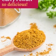 Yellow spice blend, text overlay reads "homemade curry powder - so delicious!"