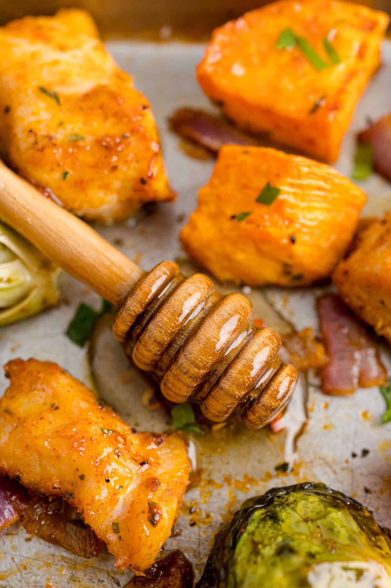 Hot honey on a sheet pan of brussels sprouts, chicken, sweet potatoes.