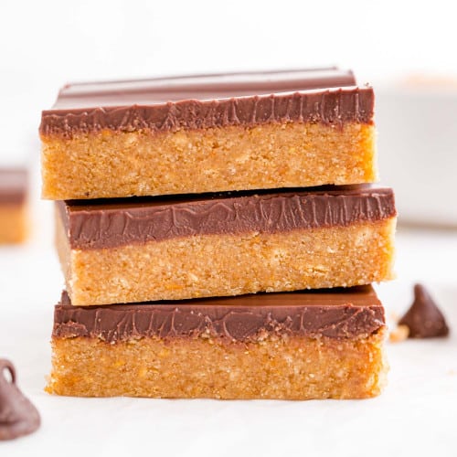 Stack of three peanut butter and chocolate bars.