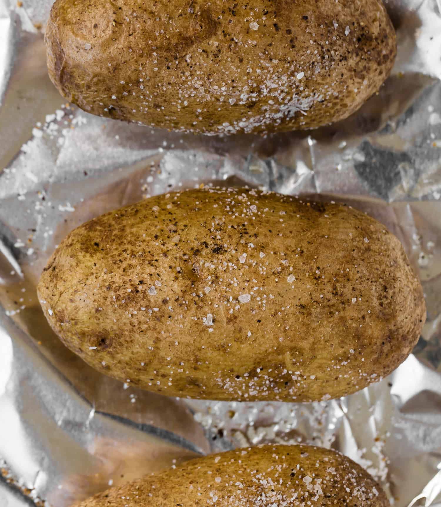 Baked potatoes with salt and pepper.
