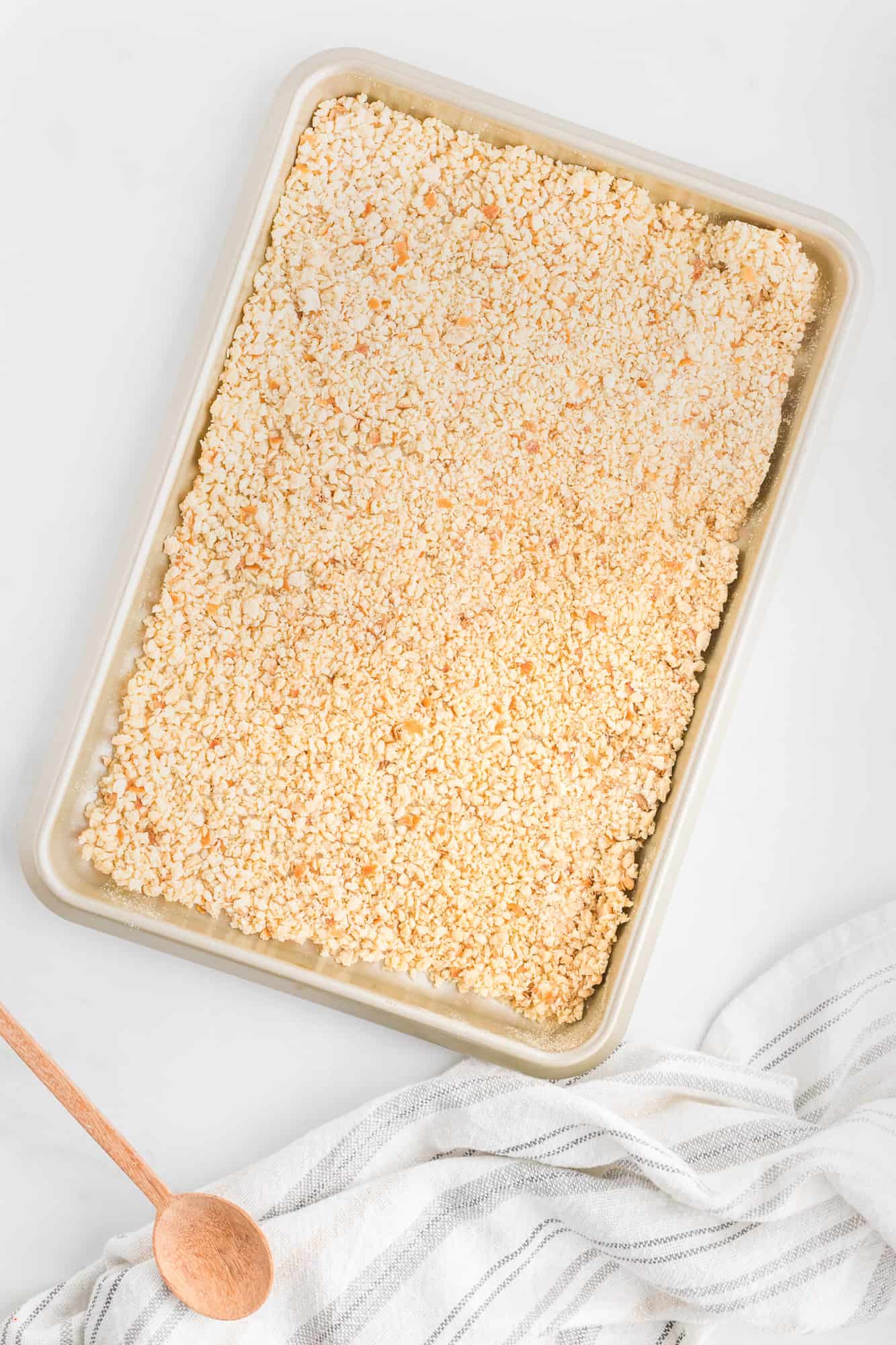 Bread crumbs on a baking sheet.