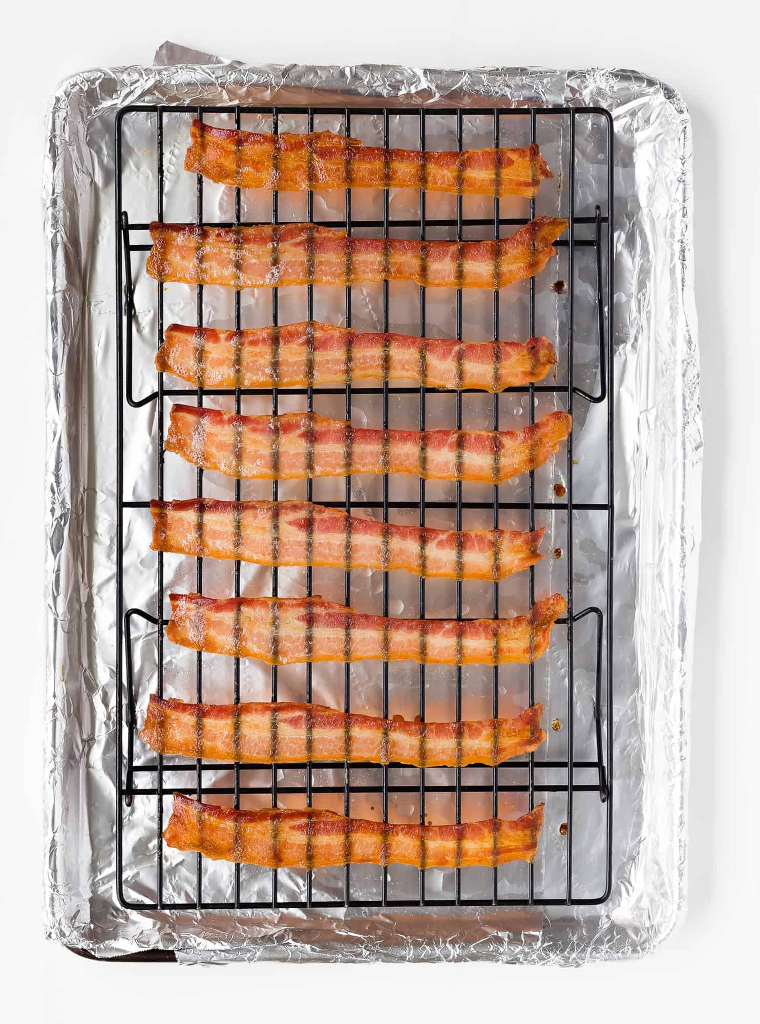 Crispy baked bacon on a wire rack.